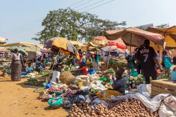 A busy open-air market is full of vendors.